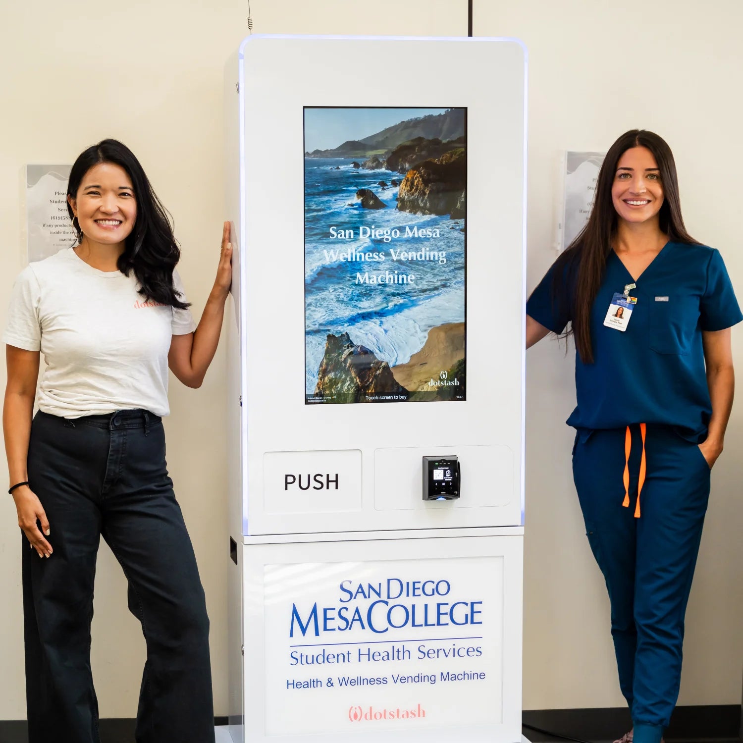 San Diego Mesa College health staff with Mona Powell standing next to a Dotstash Smart Wellness Vending Machine for students.